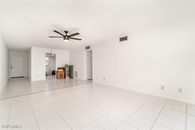 1006 SE 46th St Unit 1C, Cape Coral, FL 33904 - unfurnished living room featuring light tile patterned floors, visible vents, a textured ceiling, and ceiling fan
