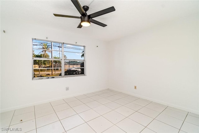 1006 SE 46th St Unit 1C, Cape Coral, FL 33904 - spare room with a ceiling fan and baseboards