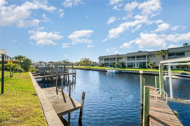 1006 SE 46th St Unit 1C, Cape Coral, FL 33904 - dock area featuring a water view and a lawn