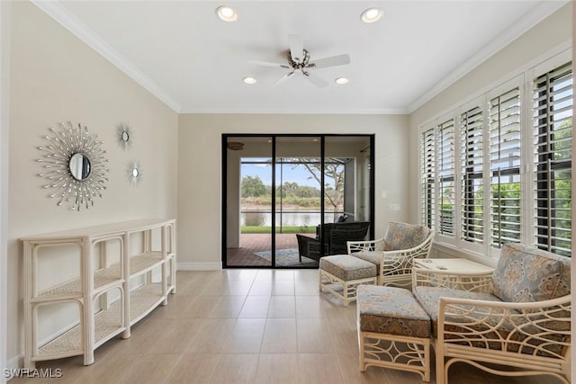 sitting room with tile patterned flooring, baseboards, ceiling fan, ornamental molding, and recessed lighting