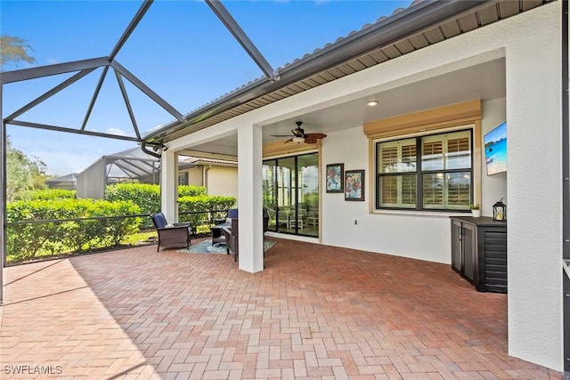 view of patio / terrace with a lanai and ceiling fan