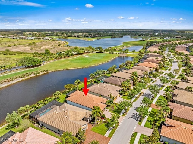 birds eye view of property with a residential view and a water view