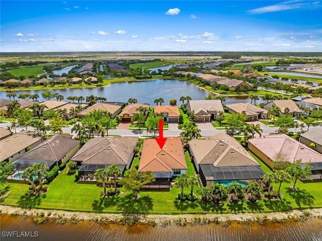aerial view featuring a residential view and a water view