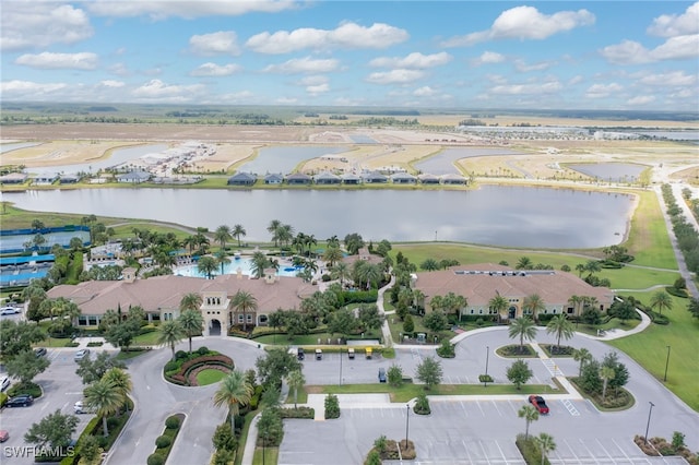 birds eye view of property with a water view and a residential view