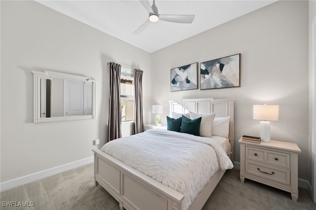 carpeted bedroom featuring baseboards and a ceiling fan
