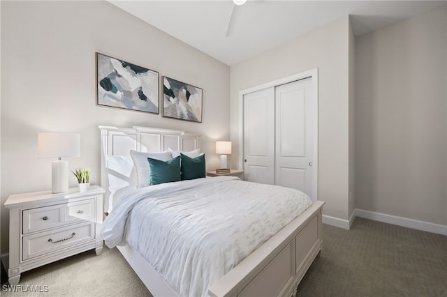 carpeted bedroom with baseboards and a closet