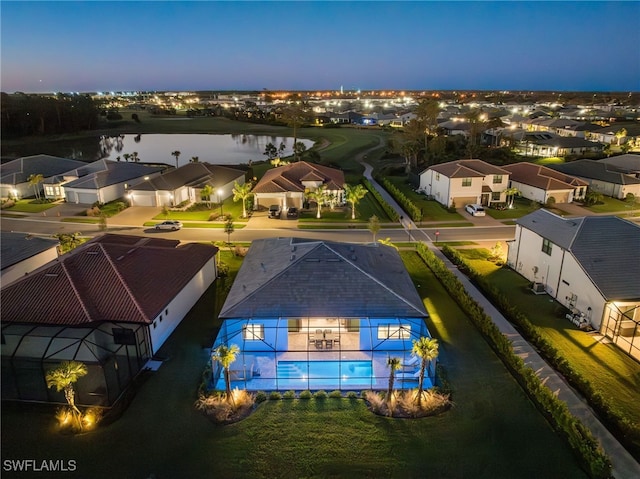bird's eye view featuring a residential view and a water view