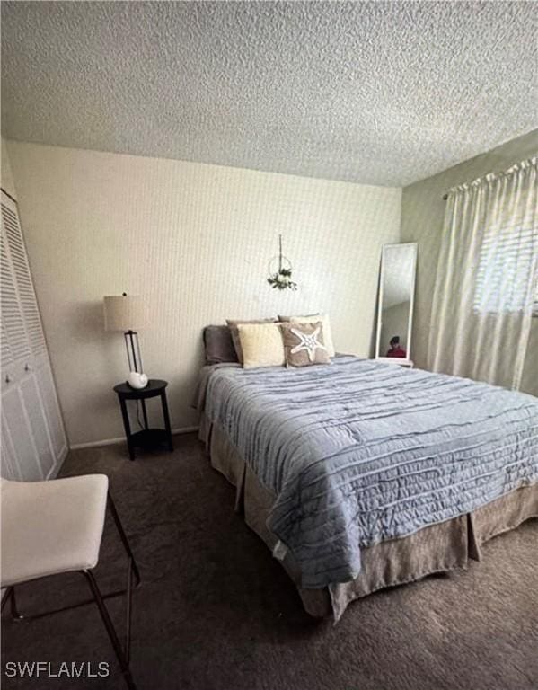 103 Teryl Rd Unit A4, Naples, FL 34112 - carpeted bedroom featuring a textured ceiling and baseboards