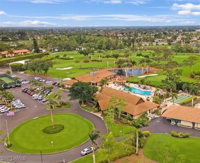 103 Teryl Rd Unit A4, Naples, FL 34112 - bird's eye view of a local golf course and a nearby body of water