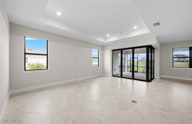 3056 Weston Manor Dr, Alva, FL 33920 - spare room with recessed lighting, a tray ceiling, and baseboards