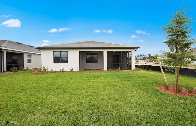 3056 Weston Manor Dr, Alva, FL 33920 - rear view of property with stucco siding, fence, a yard, and a sunroom