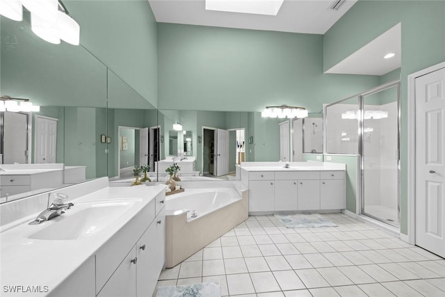 19765 Vintage Trace Cir, Estero, FL 33967 - full bath with tile patterned floors, a towering ceiling, a sink, a garden tub, and a stall shower