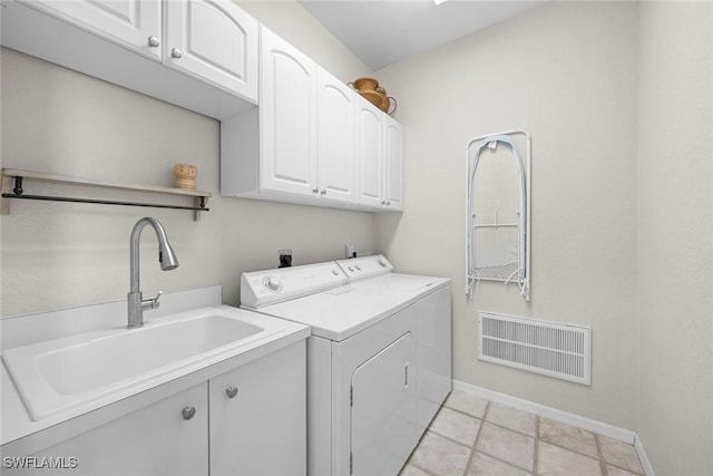 19765 Vintage Trace Cir, Estero, FL 33967 - laundry area featuring washing machine and clothes dryer, a sink, baseboards, visible vents, and cabinet space