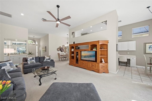 19765 Vintage Trace Cir, Estero, FL 33967 - living area with a towering ceiling, light carpet, and visible vents