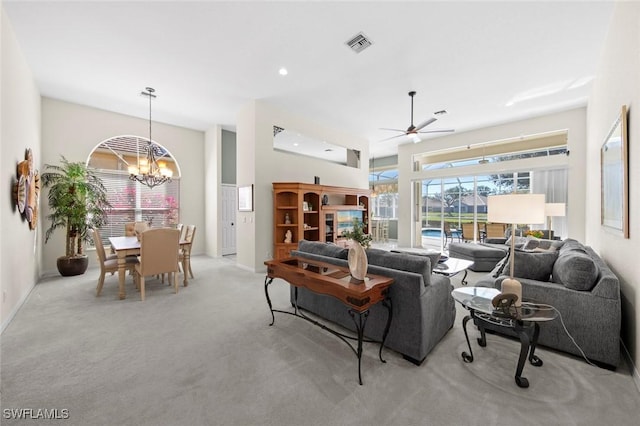 19765 Vintage Trace Cir, Estero, FL 33967 - living room with ceiling fan with notable chandelier, light carpet, baseboards, visible vents, and recessed lighting