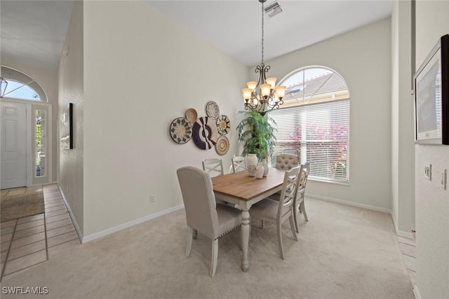 19765 Vintage Trace Cir, Estero, FL 33967 - dining space with visible vents, light carpet, baseboards, and a notable chandelier