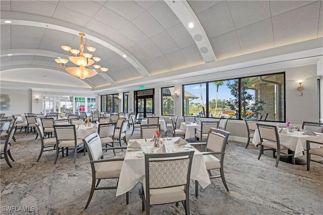 19765 Vintage Trace Cir, Estero, FL 33967 - dining space with lofted ceiling, a healthy amount of sunlight, baseboards, and an inviting chandelier