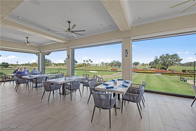 19765 Vintage Trace Cir, Estero, FL 33967 - sunroom with beamed ceiling, view of golf course, and a healthy amount of sunlight