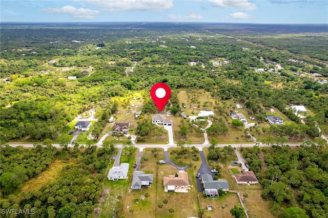2814 26th Ave SE, Naples, FL 34117 - aerial view of property and surrounding area with a heavily wooded area