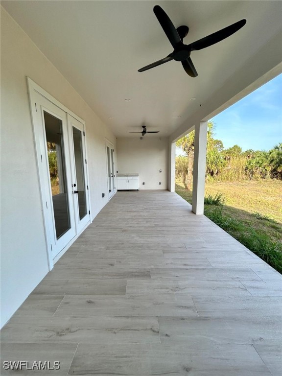 2814 26th Ave SE, Naples, FL 34117 - deck featuring french doors and ceiling fan