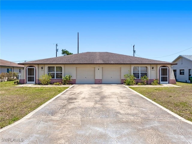 ranch-style house featuring brick siding, a front lawn, an attached garage, and driveway