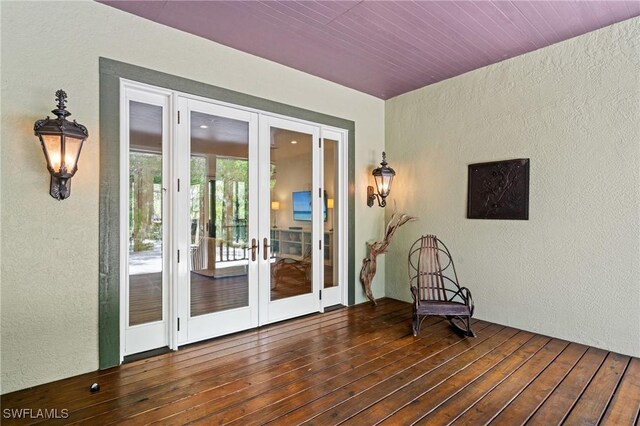 20732 Charing Cross Cir, Estero, FL 33928 - unfurnished room with french doors, a textured wall, and dark wood finished floors