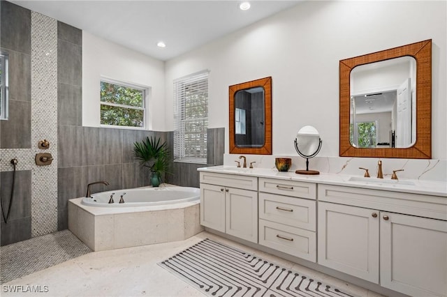 20732 Charing Cross Cir, Estero, FL 33928 - full bathroom with a garden tub, double vanity, walk in shower, and recessed lighting