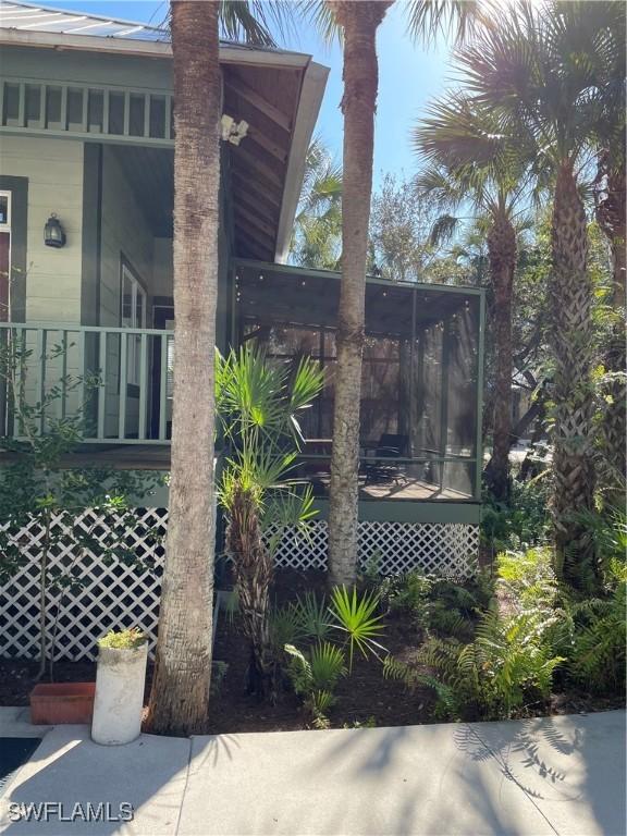 20732 Charing Cross Cir, Estero, FL 33928 - view of side of property featuring a porch and a sunroom