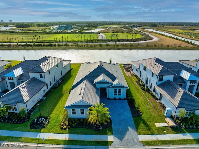 aerial perspective of suburban area with a nearby body of water