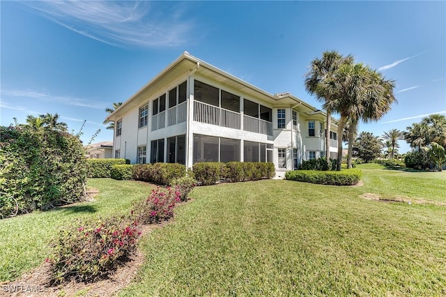 8201 Grand Palm Dr Unit 4, Estero, FL 33967 - back of house with a sunroom and a yard