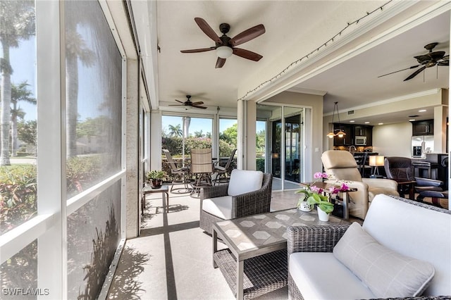 8201 Grand Palm Dr Unit 4, Estero, FL 33967 - sunroom / solarium with ceiling fan, crown molding, and outdoor dining space