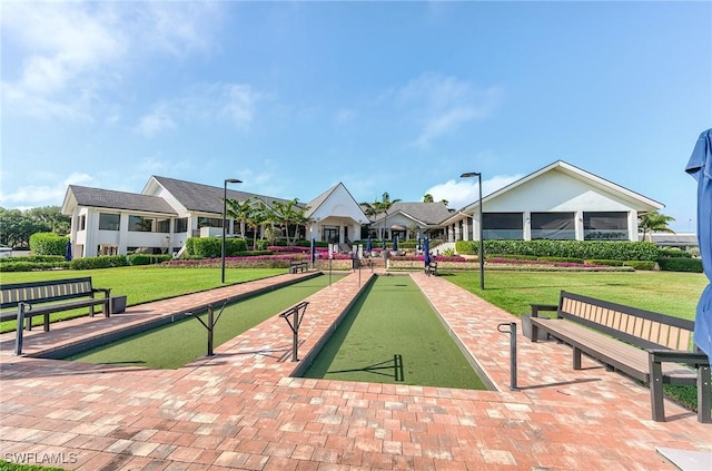 8201 Grand Palm Dr Unit 4, Estero, FL 33967 - view of community with a game area and a lawn