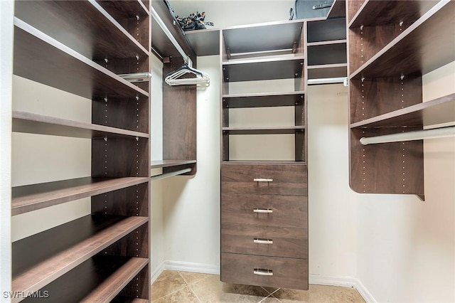 8201 Grand Palm Dr Unit 4, Estero, FL 33967 - walk in closet with tile patterned floors