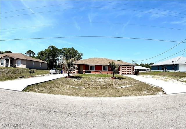 4844 Golfview Blvd, Lehigh Acres, FL 33973 - view of front of property featuring driveway and an attached garage