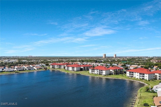 drone / aerial view featuring a residential view and a water view