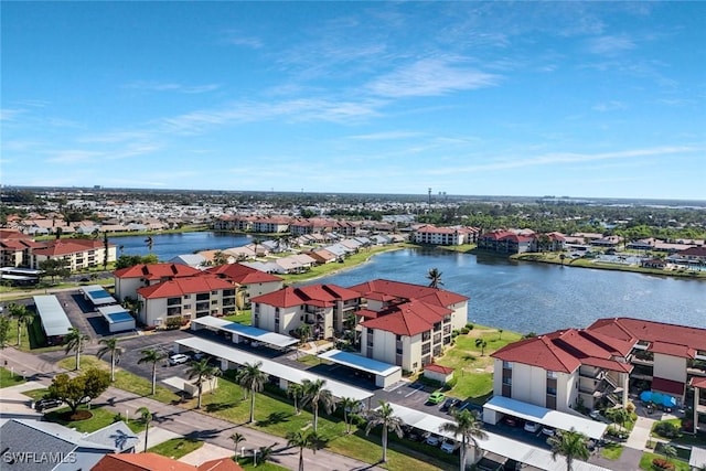 birds eye view of property with a residential view and a water view
