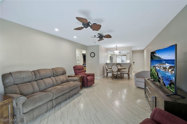 living room featuring recessed lighting, ceiling fan, and light tile patterned floors