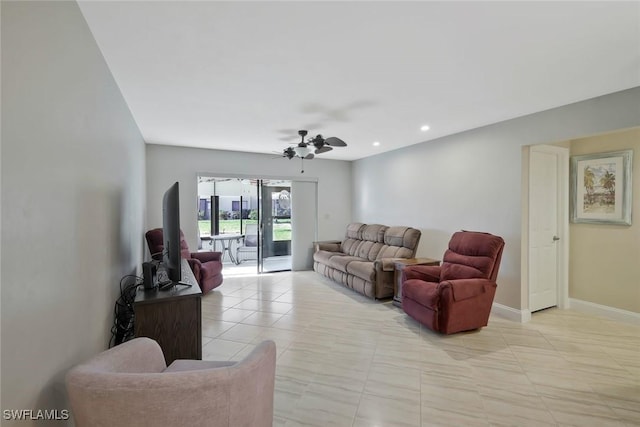 living room with light tile patterned flooring, ceiling fan, recessed lighting, and baseboards