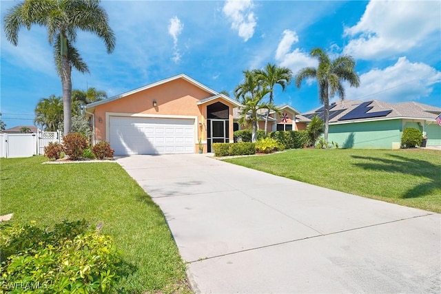 view of front of house featuring concrete driveway, stucco siding, fence, a front lawn, and a garage