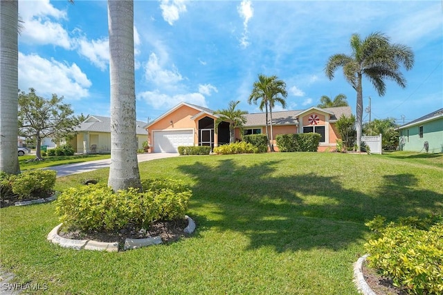 ranch-style home with a front yard, concrete driveway, stucco siding, and an attached garage