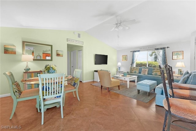 tiled dining room featuring baseboards, lofted ceiling, and ceiling fan