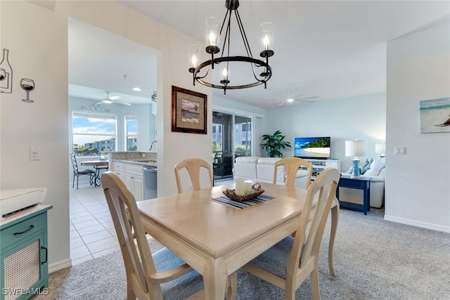 16605 Lake Circle Dr Unit 337, Fort Myers, FL 33908 - dining space with light tile patterned floors, baseboards, light colored carpet, and ceiling fan with notable chandelier