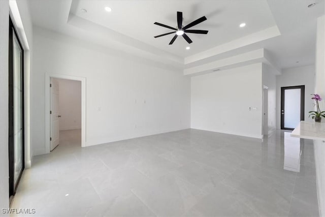 9020 S Casa Ct, Labelle, FL 33935 - spare room with a raised ceiling, recessed lighting, and a ceiling fan