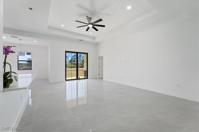 9020 S Casa Ct, Labelle, FL 33935 - spare room featuring baseboards, recessed lighting, a ceiling fan, and a tray ceiling