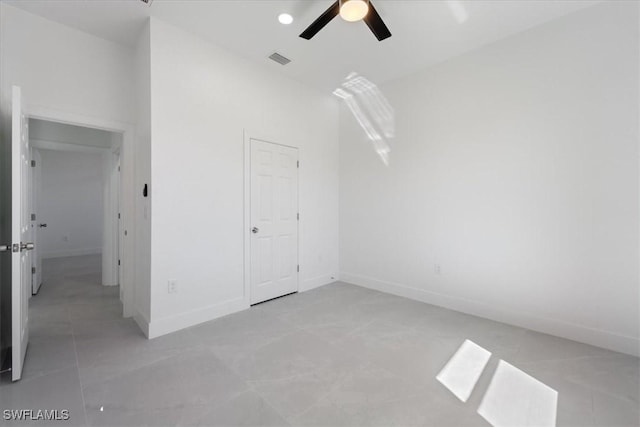 9020 S Casa Ct, Labelle, FL 33935 - unfurnished bedroom with light tile patterned flooring, visible vents, ceiling fan, and baseboards
