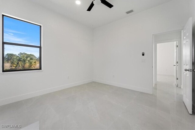 9020 S Casa Ct, Labelle, FL 33935 - unfurnished room featuring visible vents, baseboards, and a ceiling fan