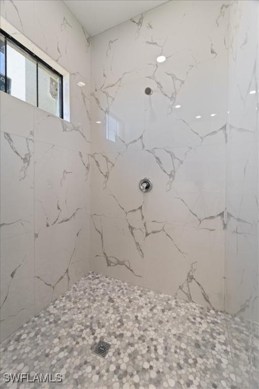 9020 S Casa Ct, Labelle, FL 33935 - full bathroom with a marble finish shower