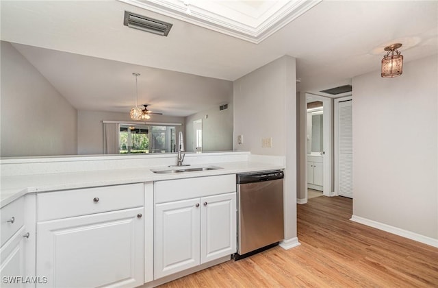 kitchen with visible vents, white cabinetry, light wood-style flooring, a sink, and dishwasher