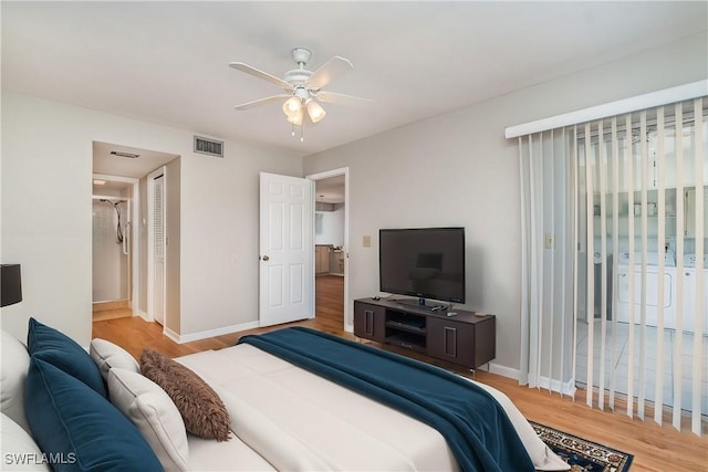 bedroom featuring visible vents, baseboards, wood finished floors, a closet, and a ceiling fan