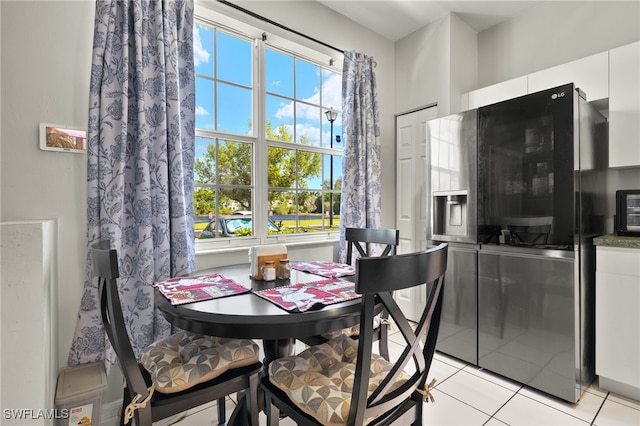 3627 Pine Oak Cir Unit 101, Fort Myers, FL 33916 - dining room with healthy amount of natural light and light tile patterned floors